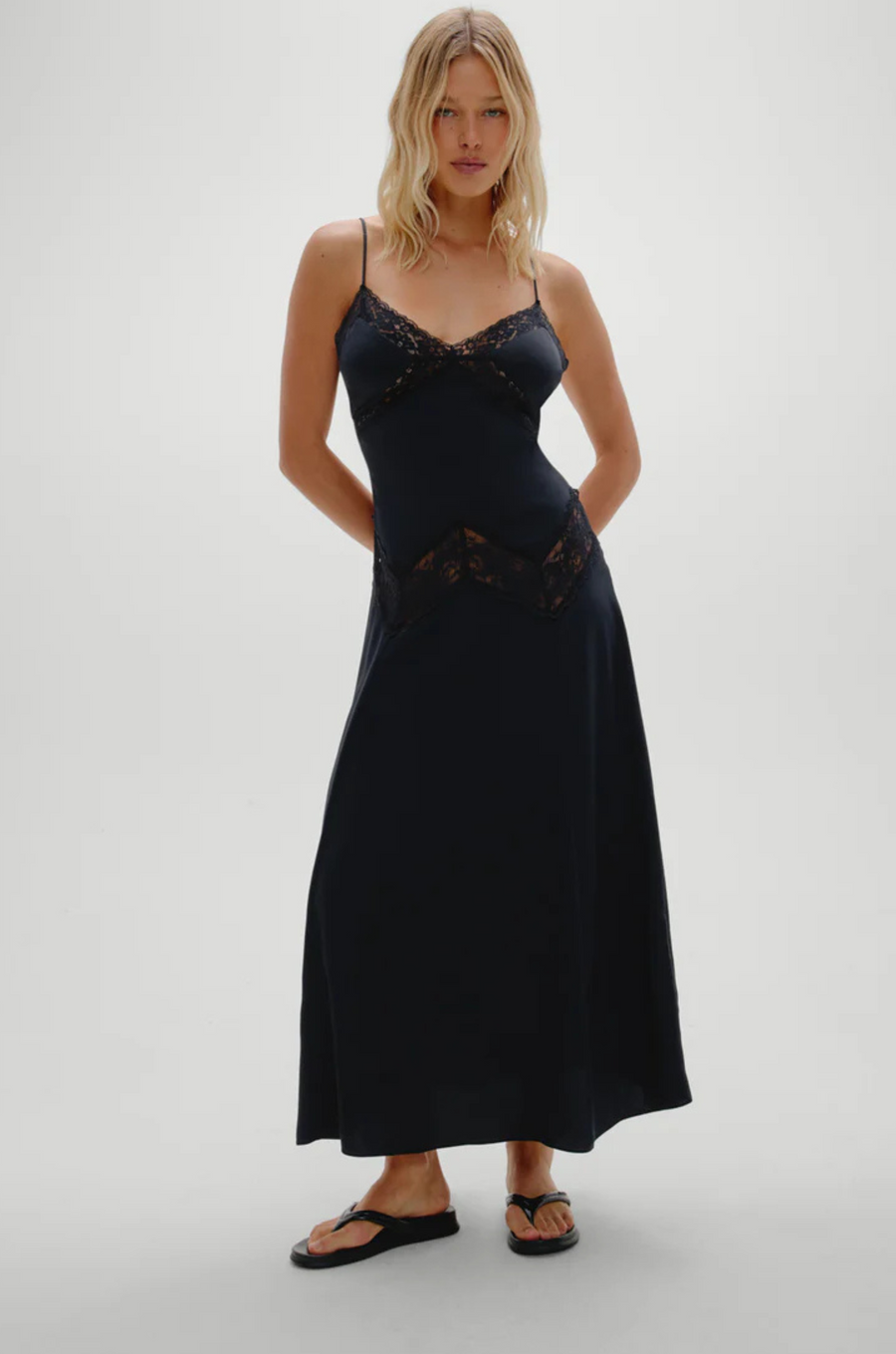 Designed with see-through lace that traces the neckline and hips
Shine satin fabrication
Sheer lace accents
Fitted cups
Adjustable shoulder straps that tie in the back
Hidden zipper closure
No bra recommended; pair with nude underwear
Polyester