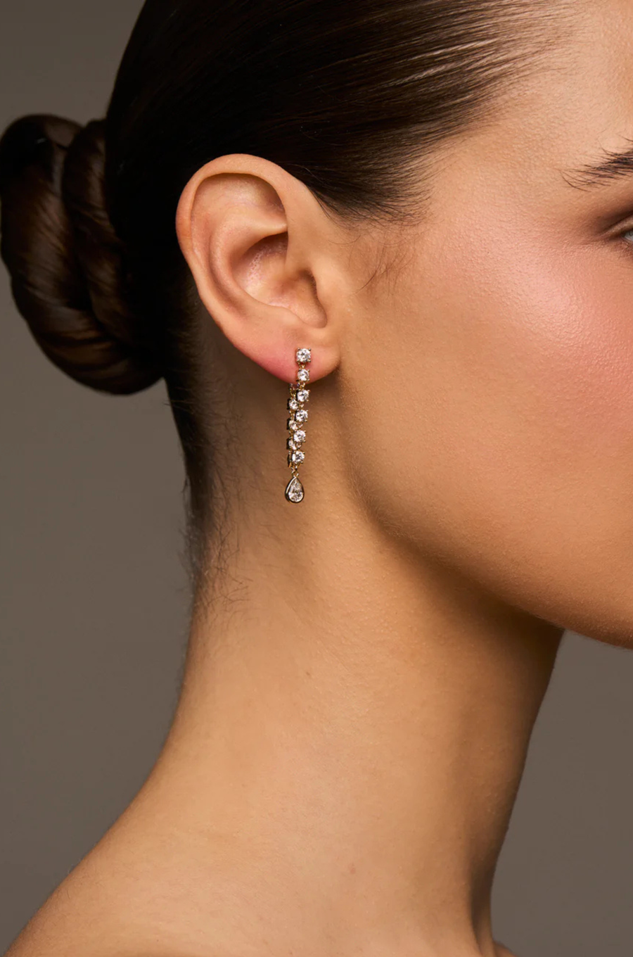 Prong-and-bezel style earrings
Available in 14kt gold plated brass or Rhodium plated brass
Stones are white CZs,&nbsp; measuring 3.0–3.5mm round and 6x4mm pear
Post fastening for pierced ears
Sold as a pair
gold droop earrings
fancy earrings