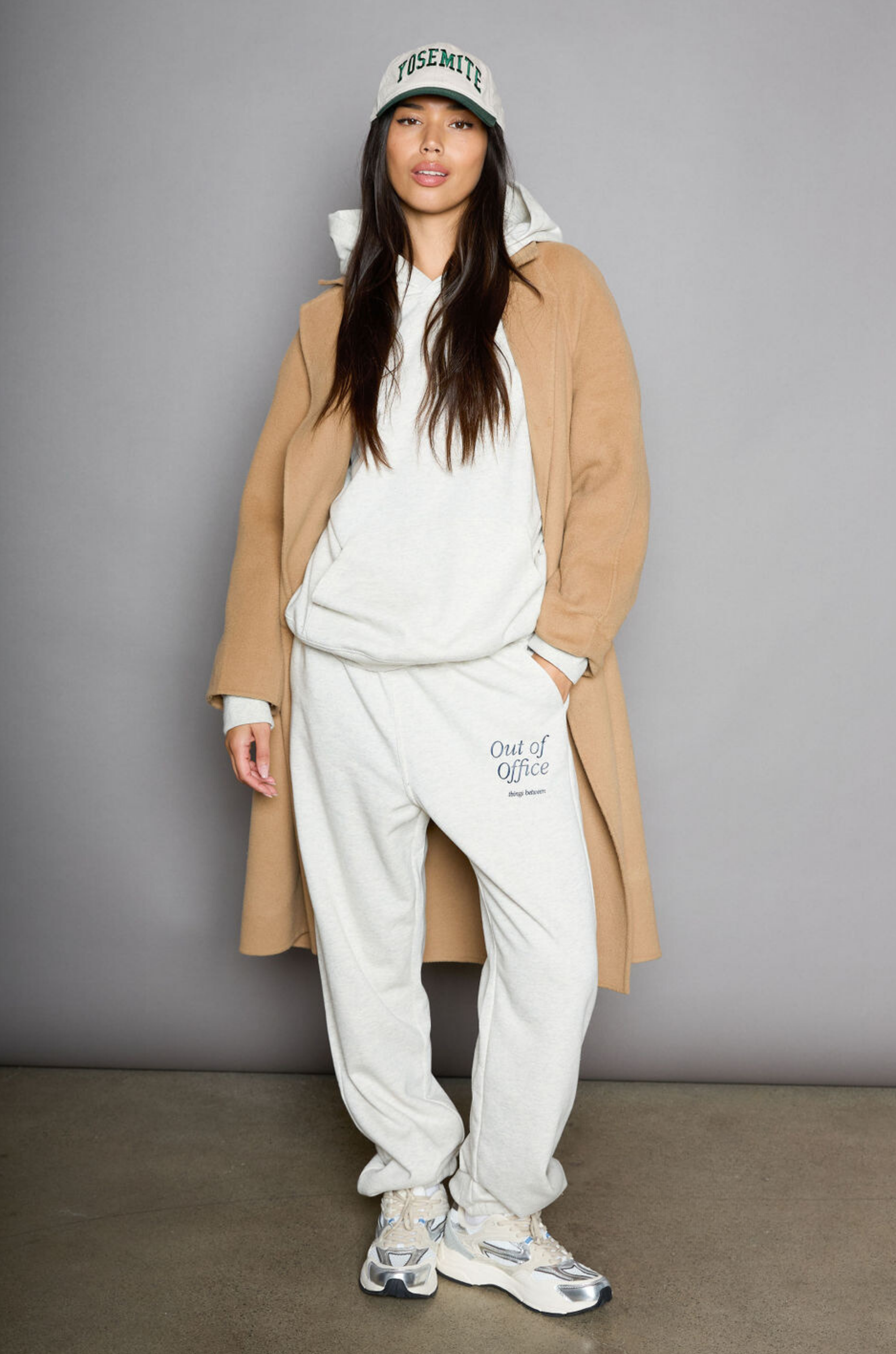 Graphic printed knit sweatset. Elastic waistband and leg openings. Side pockets. Fleece lining. hooded sweater. sweatpant. grey sweatset. out of office sweat set
