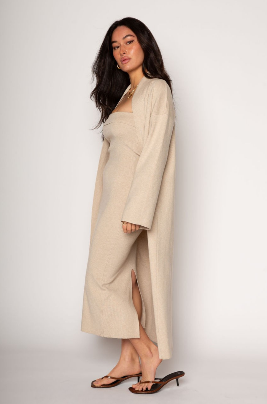 Ribbed knit longline cardigan. Open front. Long sleeves. Unlined. Ribbed knit maxi dress. Strapless elastic folded neckline. Back slit. Unlined. tan dress cardigan set