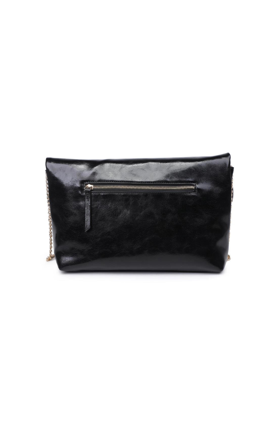 Crossbody vegan shiny leather purse
Removable chain strap
Outer zip pocket
Inner zip and slip pocket
Magnetic closure
Lined
Vegan Leather
black leather clutch bag purse