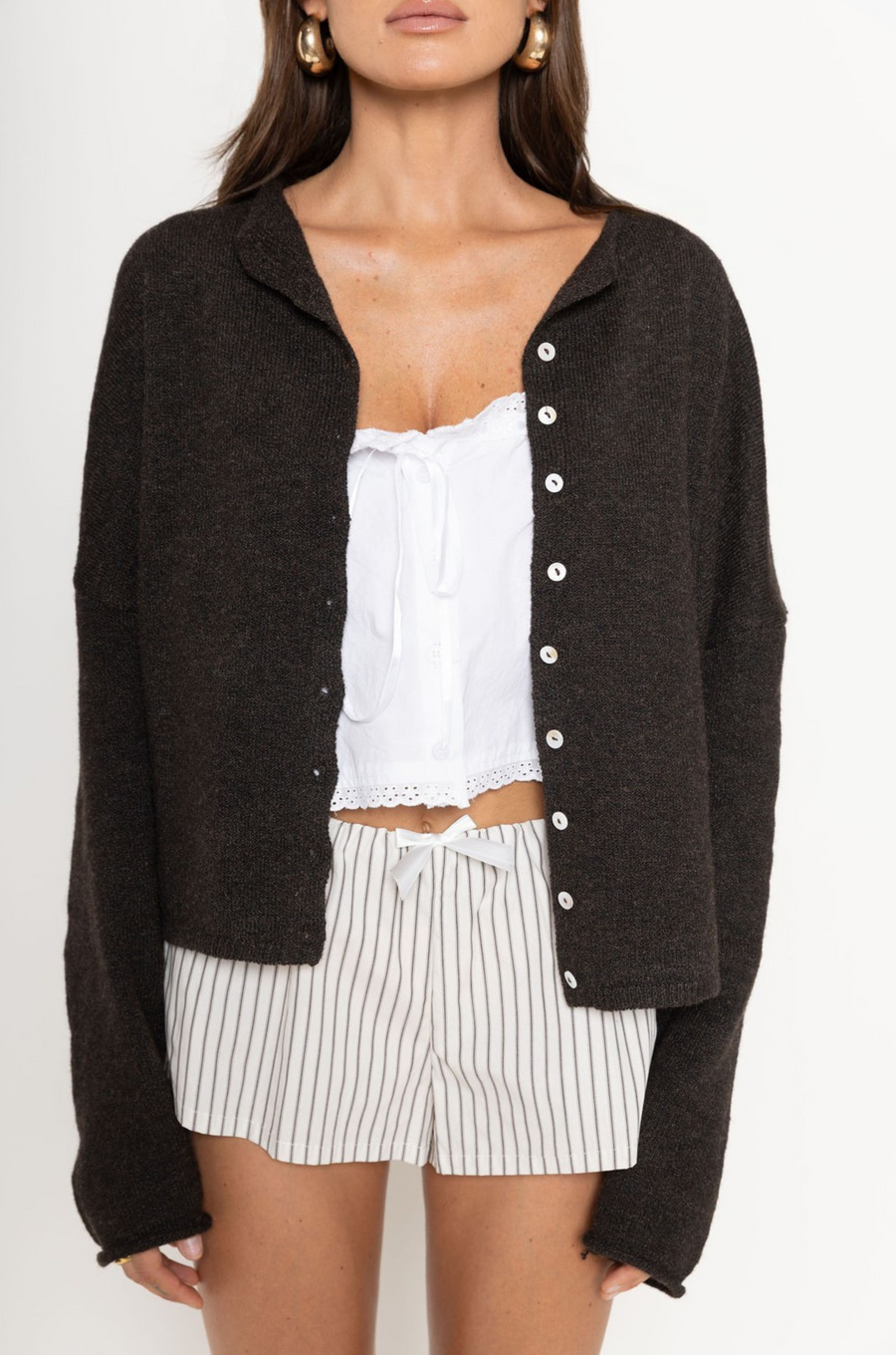 Fuzzy knit cardigan
Crewneck
Front button down closures
Long sleeves
Unlined
chocolate brown cardigan
fall cardigan
fall outfit
fall transition outfit