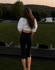 white Eyelet crop top
Balloon short sleeve
Fixed front bow
Elastic band
Unlined/Sheer