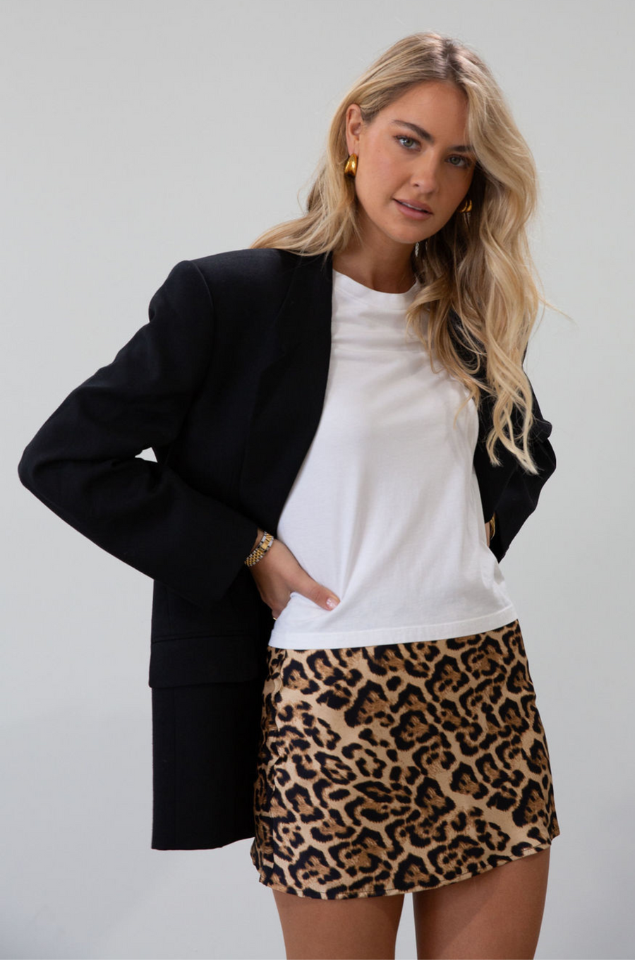 Animal printed satin skirt. Side hook and eye and zipper closures. Fully lined.