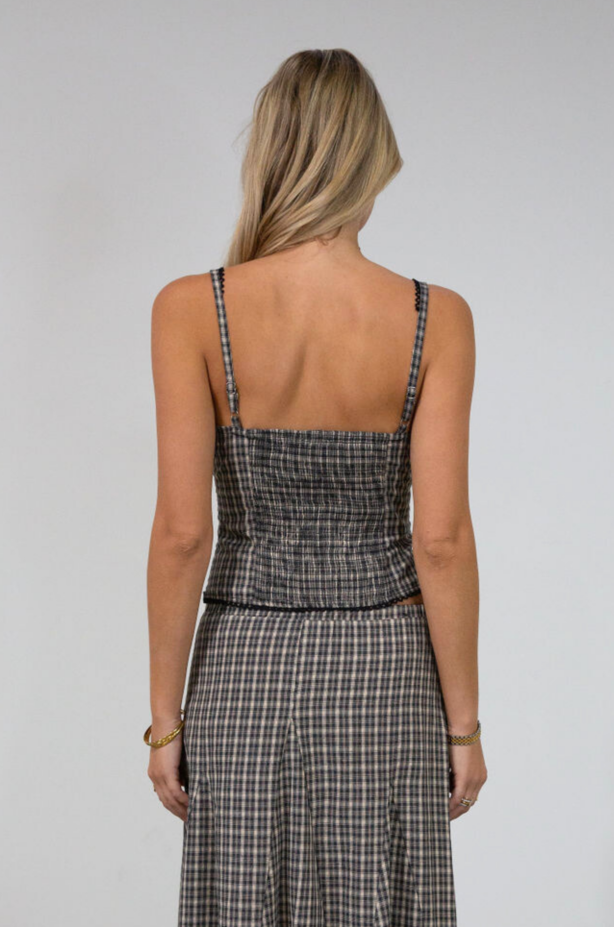 Plaid woven bustier top. Adjustable straps. Drawstring front closure. Front button down closures. Side zipper closure. Elastic smocked back panel. Fully lined. fall top. gingham top. thanksgiving outfit. friendsgiving outfit. fall outfit