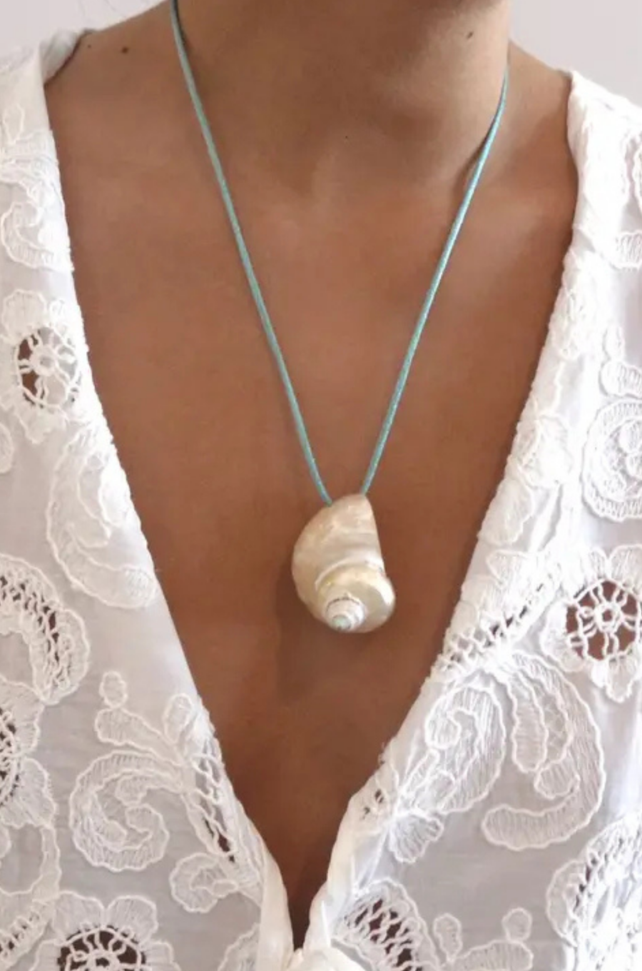 Turbo shell silk cord necklace
Polished and hand-drilled
Silk cord with gold plated beads
Can be worn multiple ways
Length: 26"
Turbo shell approx. 1.5"
Size color and shape of shell may vary slightly