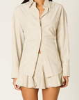 cream Oversized striped shirt
Button down closure
Lace up tie detail at back to adjust for a more fitted look
Shell buttons
Unlined