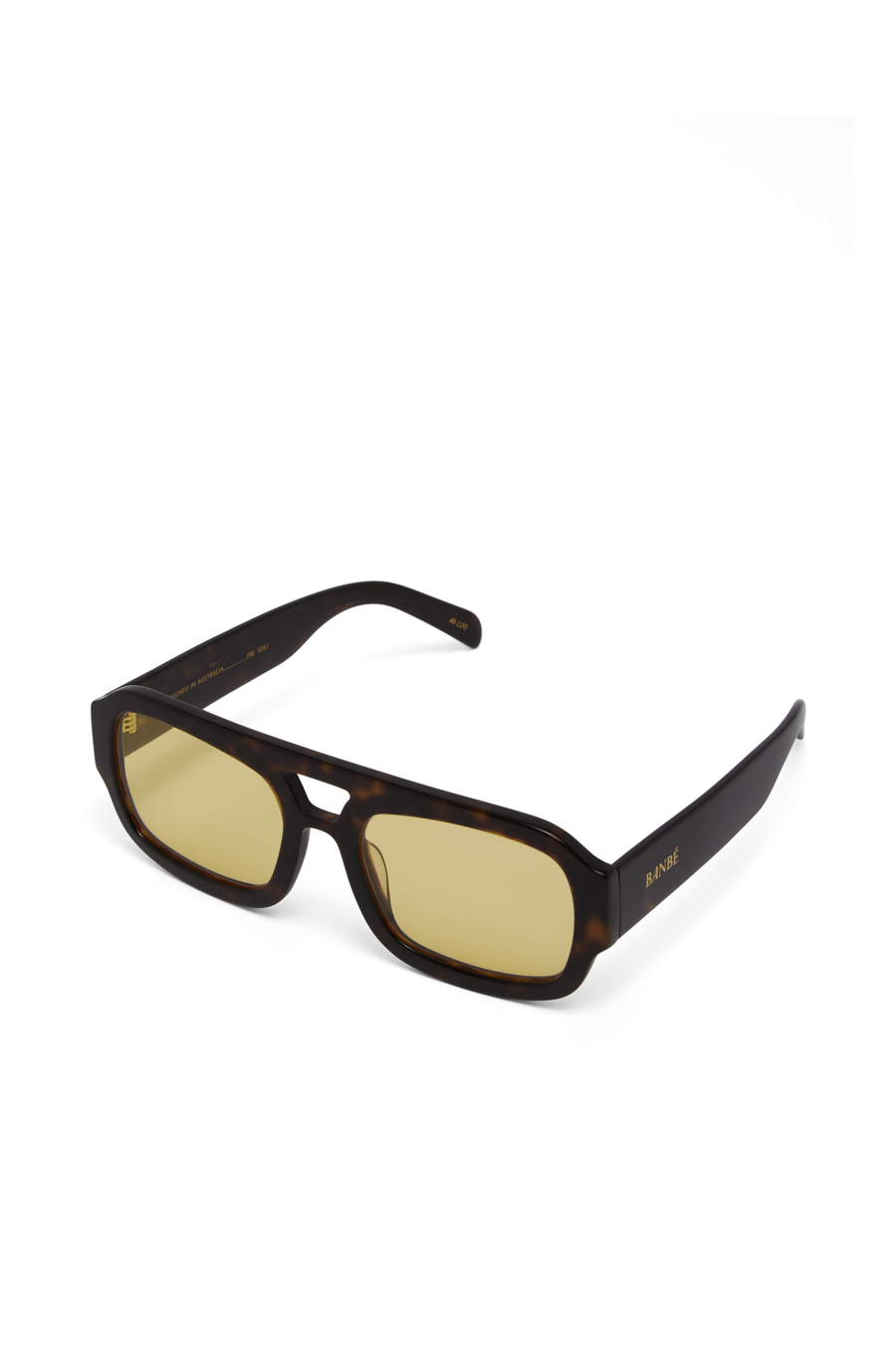 The Suki by Banbé are modern aviator sunglasses
Gold embossed Banbé logo on outer left arm
Style details printed in gold foil on inner right arm
Scratch resistant/category 3/polarized lens
100% UV protection
Acetate frame
Includes branded vegan case &amp; cleaning cloth
Designed in Australia
Width: 10.5cm / Lens Height: 5.1cm / Arm Length: 14cm / Nose Bridge: 3.5cm
yellow lens sunglasses
tort and yellow sunglasses