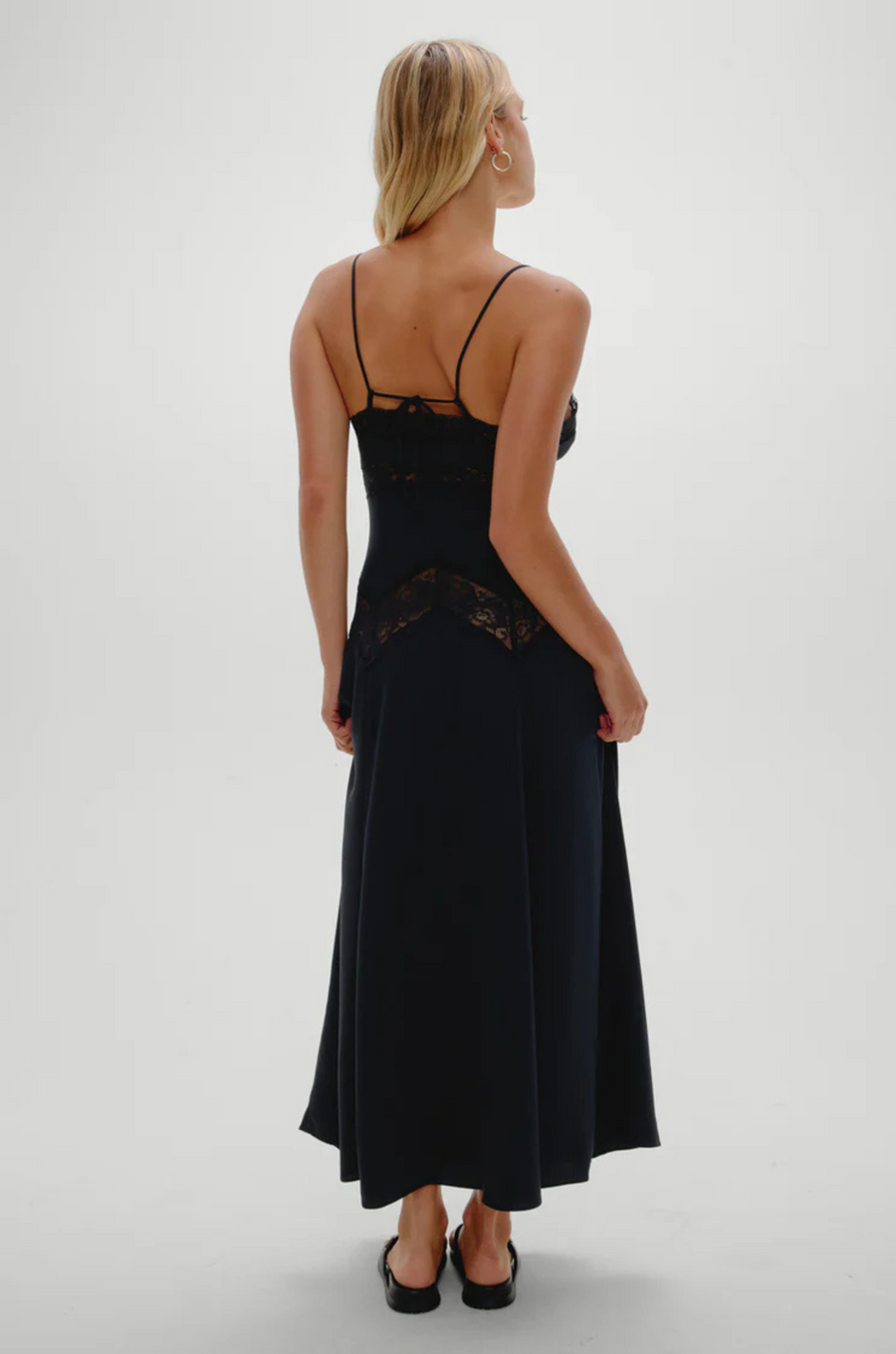 Designed with see-through lace that traces the neckline and hips
Shine satin fabrication
Sheer lace accents
Fitted cups
Adjustable shoulder straps that tie in the back
Hidden zipper closure
No bra recommended; pair with nude underwear
Polyester