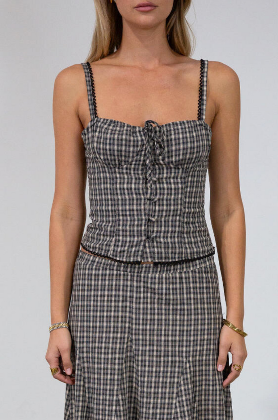 Plaid woven bustier top. Adjustable straps. Drawstring front closure. Front button down closures. Side zipper closure. Elastic smocked back panel. Fully lined. fall top. gingham top. thanksgiving outfit. friendsgiving outfit. fall outfit