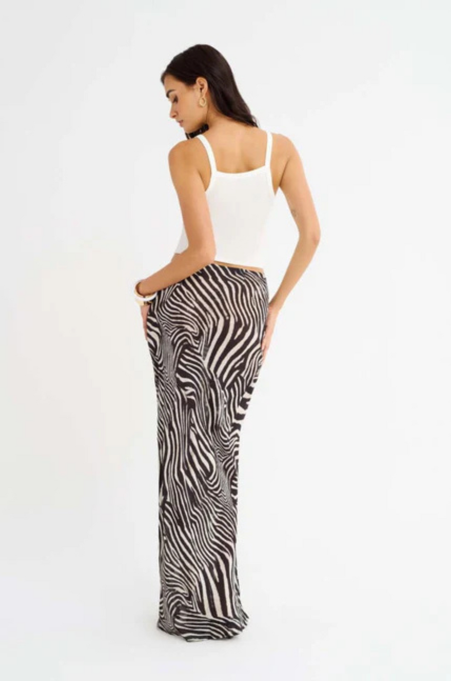 Zebra printed maxi skirt
Elastic waistband
Bias cut
Unlined/Sheer