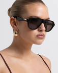 Oversized aviator frame
Featuring a straight brow line
Teardrop-shaped lenses
Distinctive keyhole bridge
Thick, structured frame with sculptural finish
tortoise frame with brown lens aviator sunglasses
