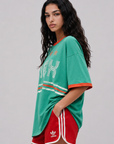 Game on. Keep your eye on the ball in this OS Ringer Tee designed in colors inspired by the Team Mexico jersey.
Featuring an athletic influence with rib contrast along the neckline and arms.
Oversized fit and length, accented with dropped shoulders
Available in just one size
Length: 27.5"
Cotton
green mexico world cup jersey tee