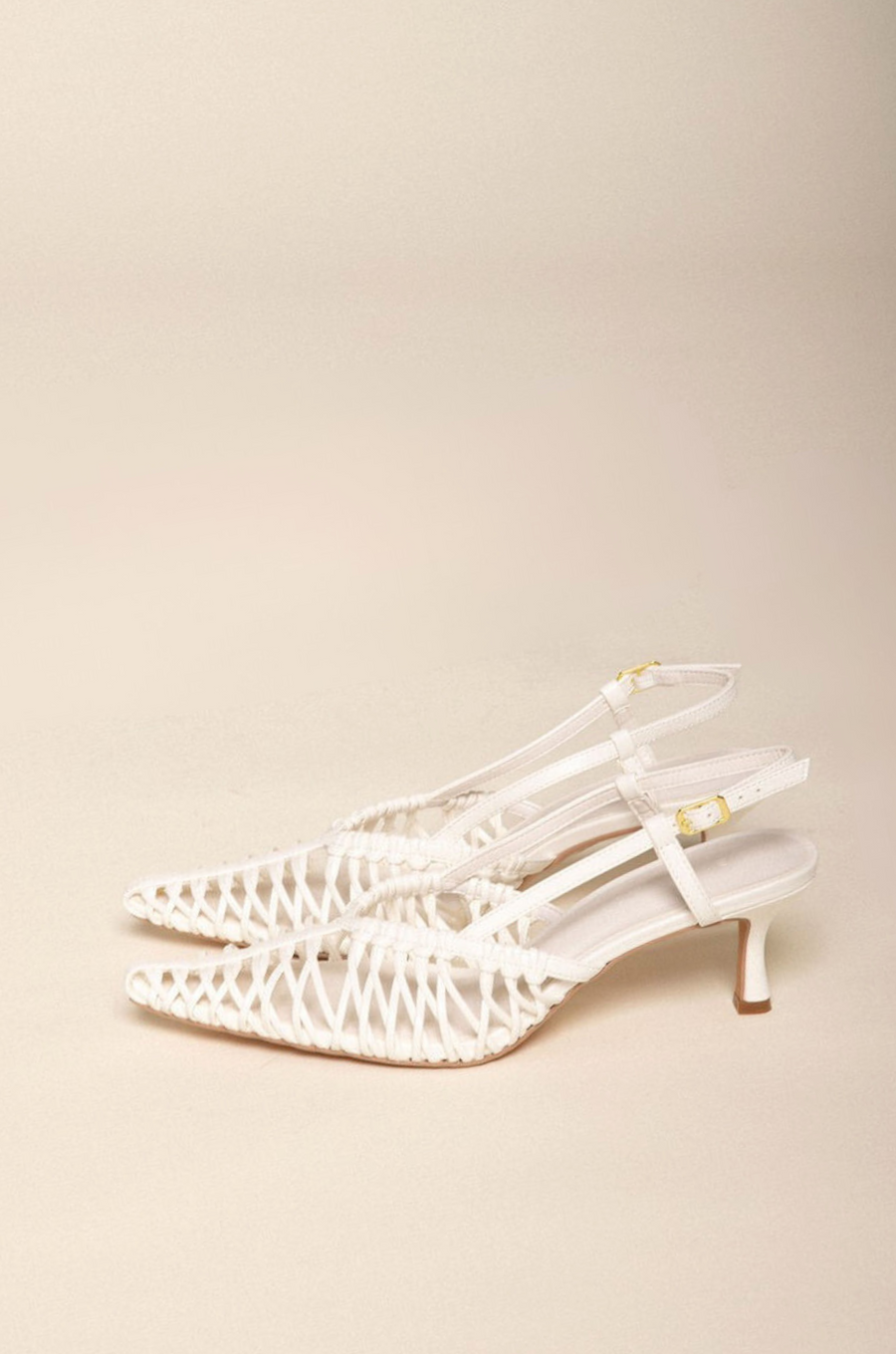 Low kicked-in stiletto heel
Closed pointed toe
Strappy detailing on vamp
Sling back ankle strap with adjustable buckle
Exposed heel counter
Heel height: 6cm
Synthetic upper
white scrappy heel
bridal heels