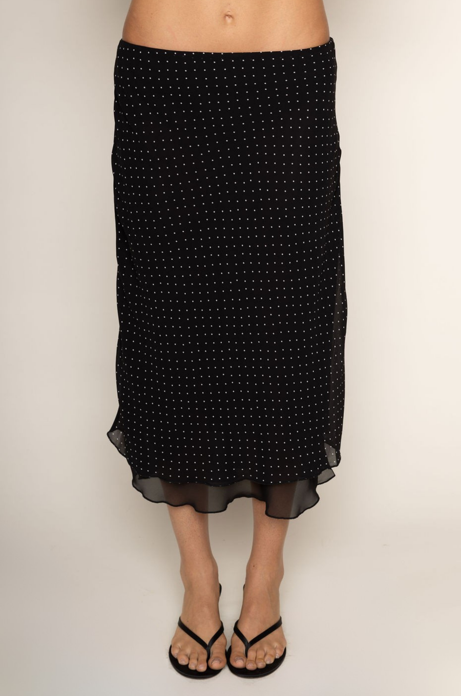 Chiffon polka dot midi skirt
Peek-a-boo under layer
Side zipper closure
Lined
black and white polka dot midi skirt