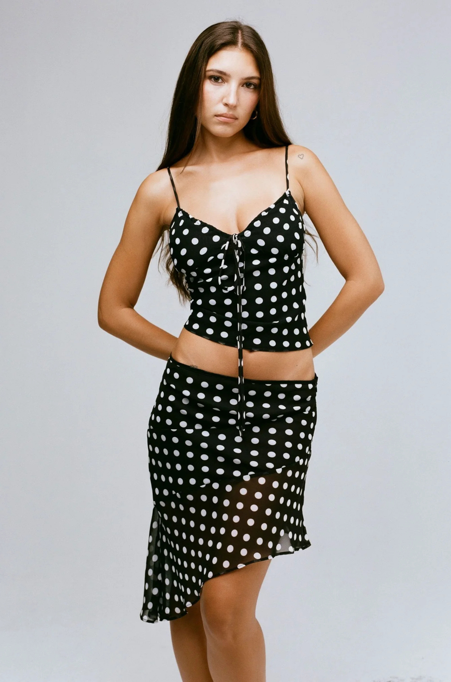 Polka dot mini skirt
Asymmetrical hemline
Side zipper closure
Partially lined/Partially sheer
black and white polka dot mini skirt
black and white polka dot midi skirt
