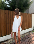 white Halter mini dress
Adjustable neck tie
Side pockets
Lined