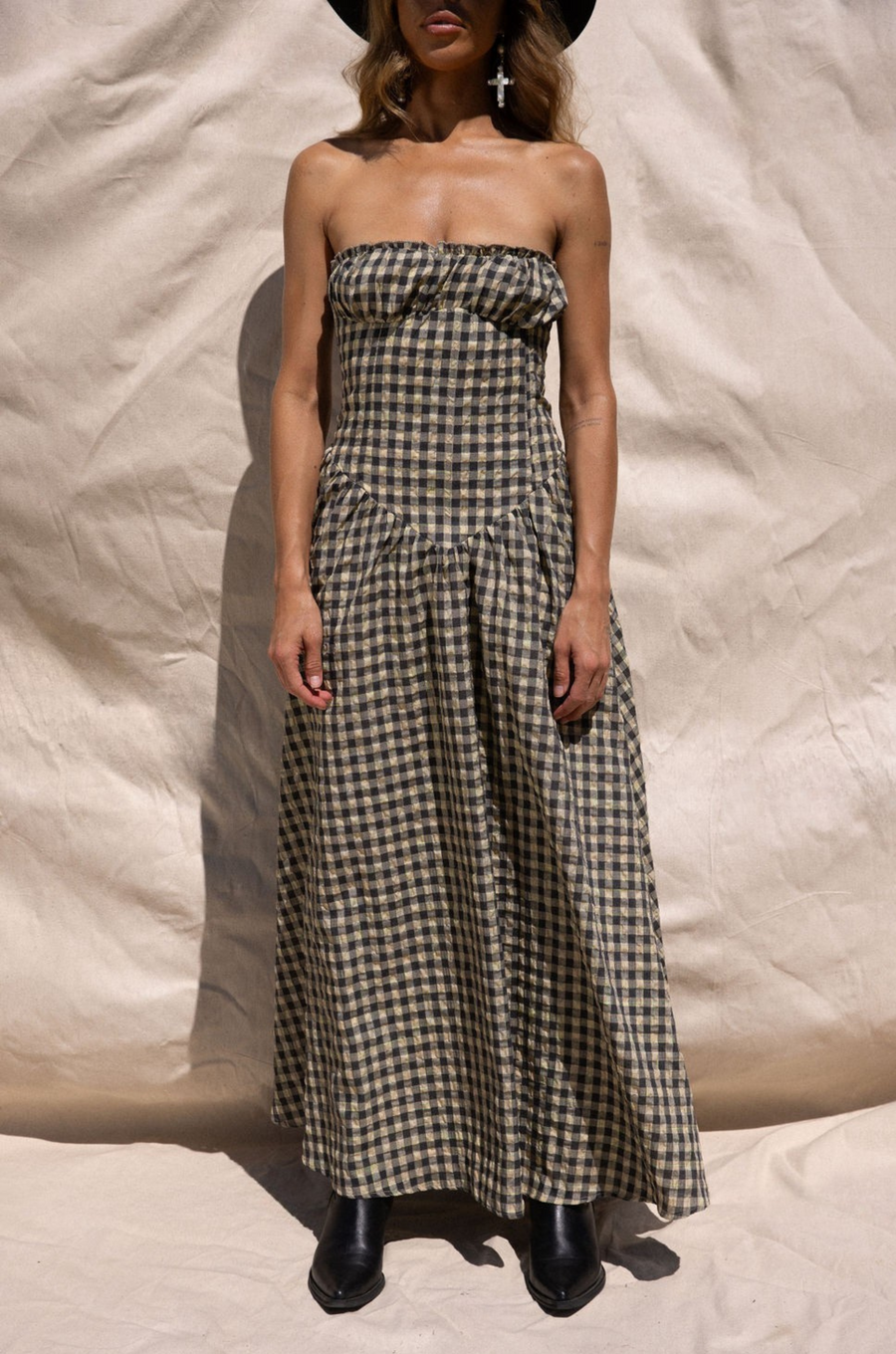 Plaid woven maxi dress. Elastic strapless neckline. Inner rubber grip lining. Elastic smocked back panel. Back hook and eye and zipper closures. Fully lined. Paid maxi dress. ranch outfit. western outfit. stagecoach dress. country concert dress. festival outfit