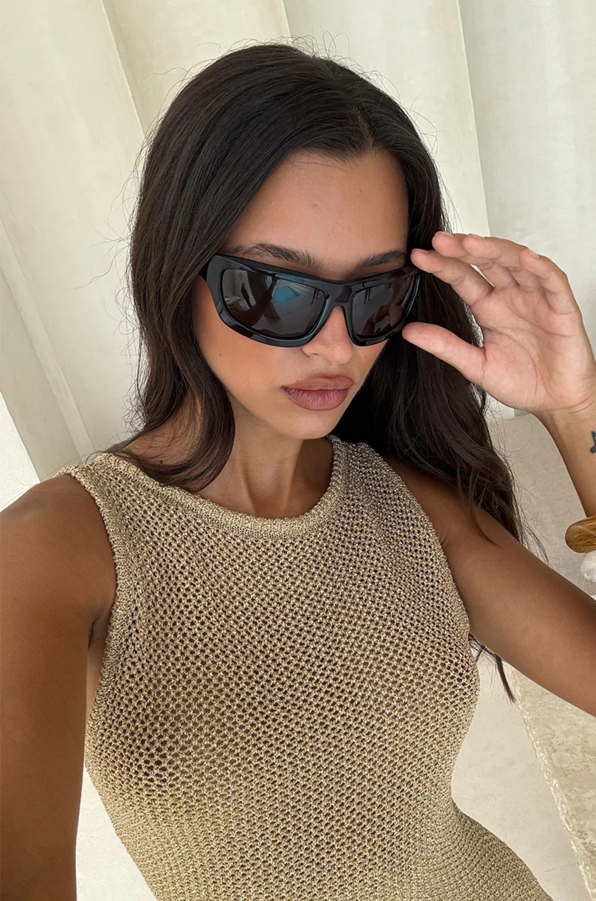 Knit mini dress
Subtle shimmer
Delicate seashell hardware 
Boat neck 
Slip on style 
Unlined/sheer
Lurex/Viscose
gold metallic mini dress
resort wear mini dress
beach vacation outfit