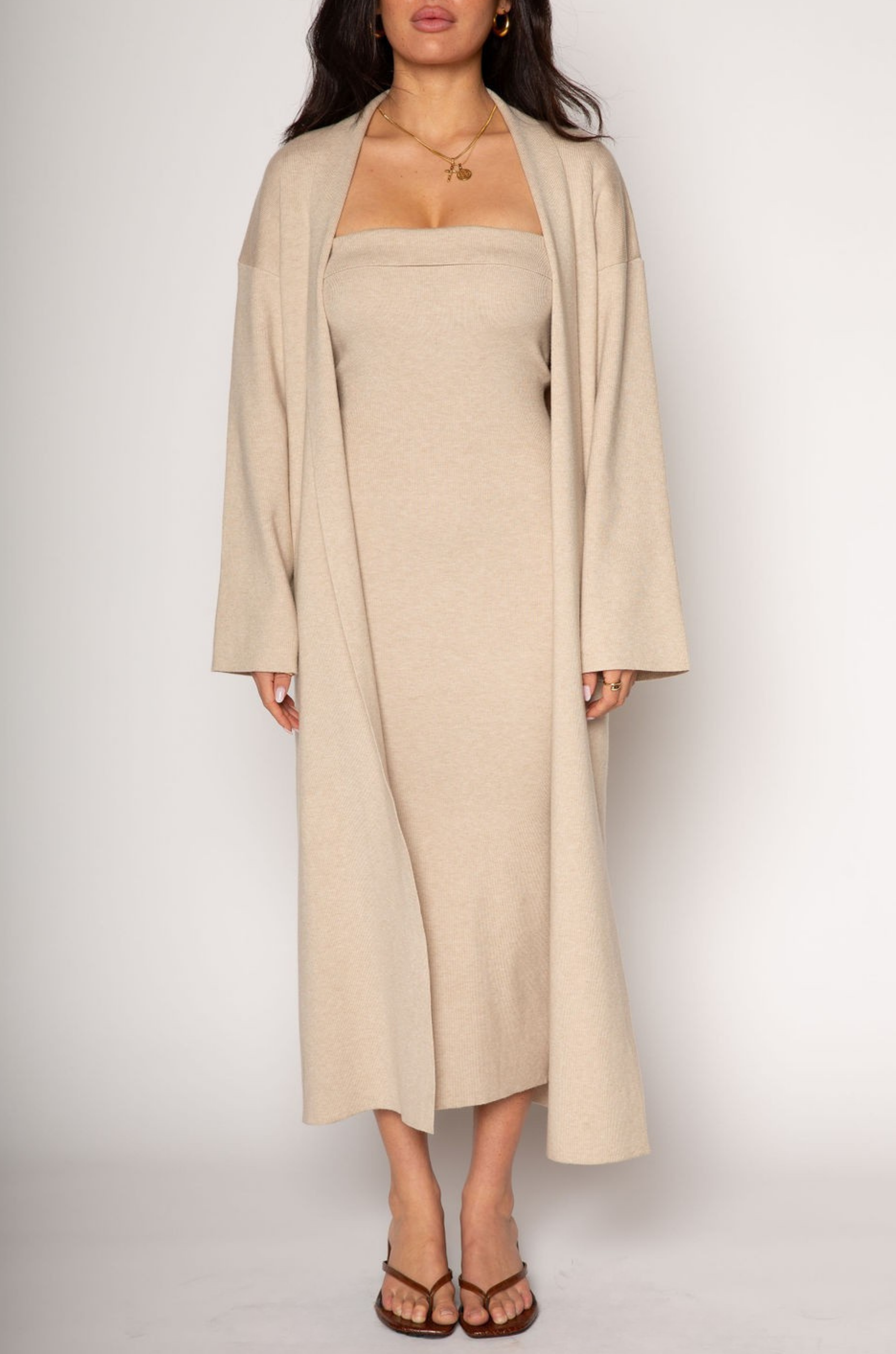 Ribbed knit longline cardigan. Open front. Long sleeves. Unlined. Ribbed knit maxi dress. Strapless elastic folded neckline. Back slit. Unlined. tan dress cardigan set