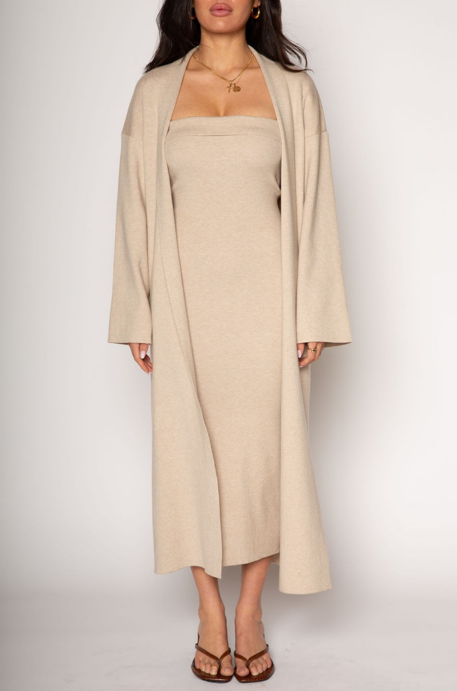 Ribbed knit longline cardigan. Open front. Long sleeves. Unlined. Ribbed knit maxi dress. Strapless elastic folded neckline. Back slit. Unlined. tan dress cardigan set