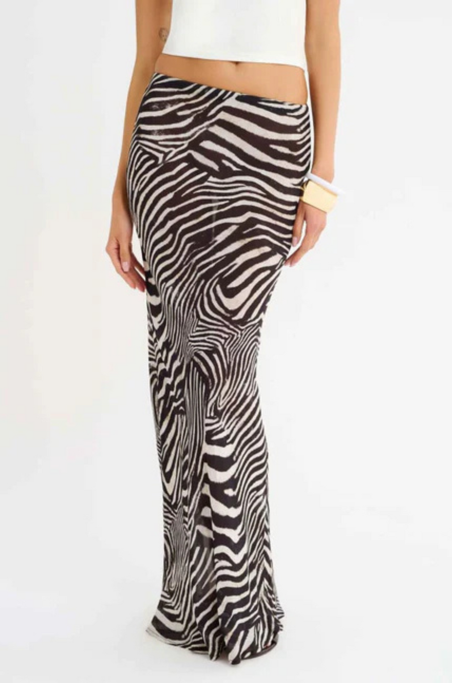 Zebra printed maxi skirt
Elastic waistband
Bias cut
Unlined/Sheer