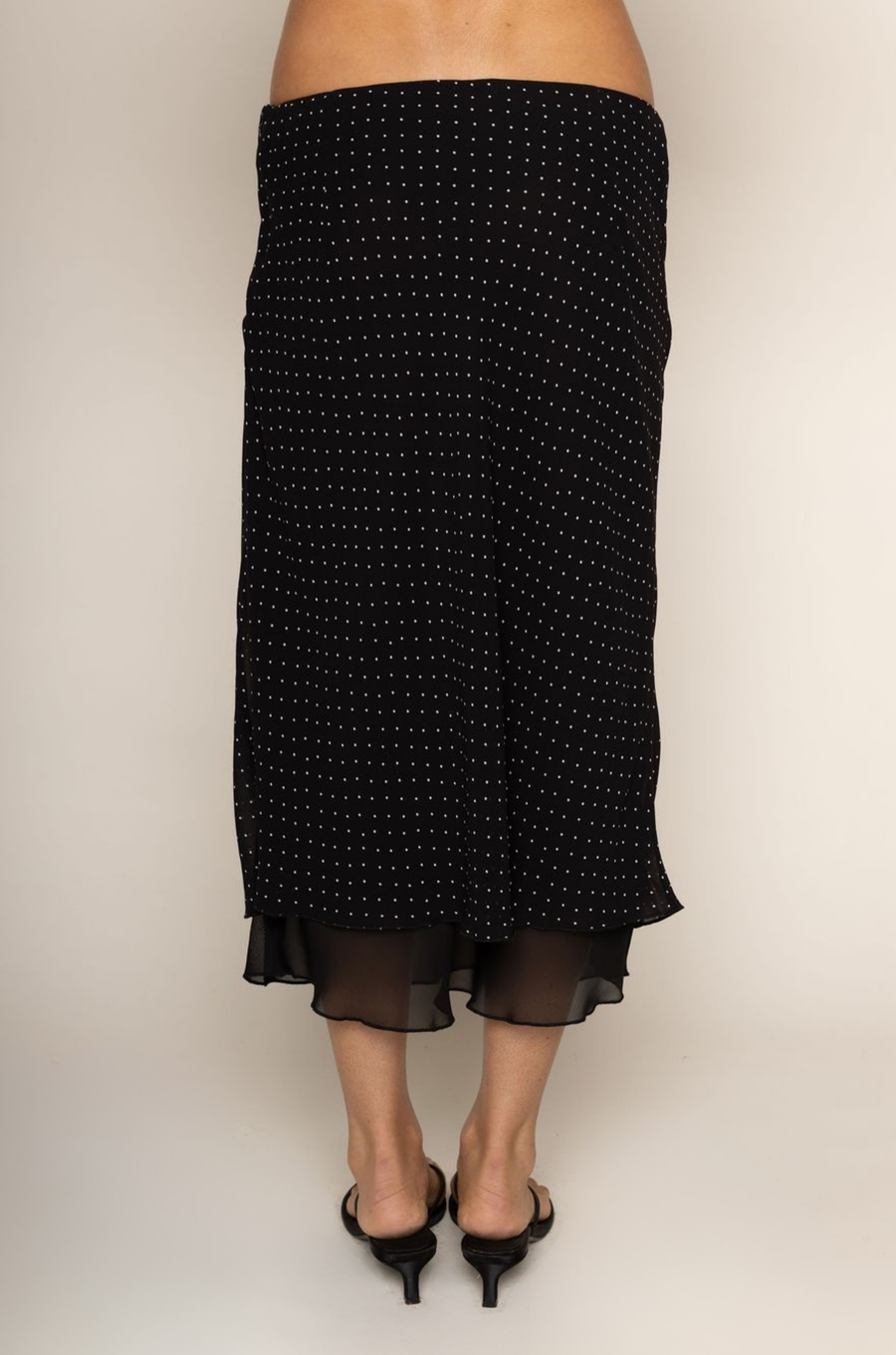 Chiffon polka dot midi skirt
Peek-a-boo under layer
Side zipper closure
Lined
black and white polka dot midi skirt