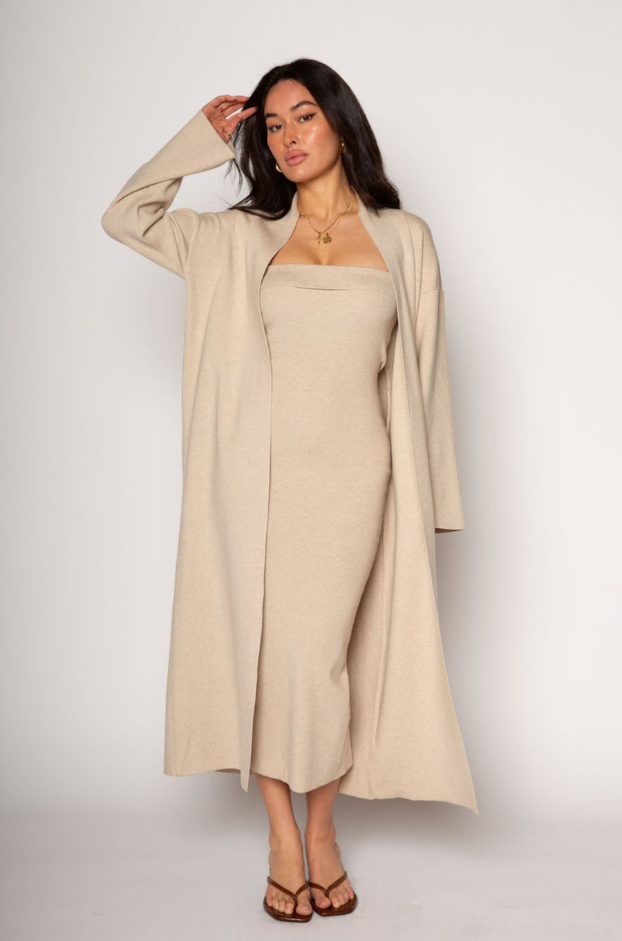 Ribbed knit longline cardigan. Open front. Long sleeves. Unlined. Ribbed knit maxi dress. Strapless elastic folded neckline. Back slit. Unlined. tan dress cardigan set