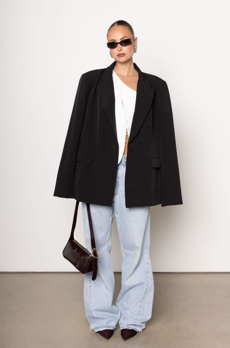 One shoulder button up top
Button down closure
Sleeveless
white one shoulder top
going out top