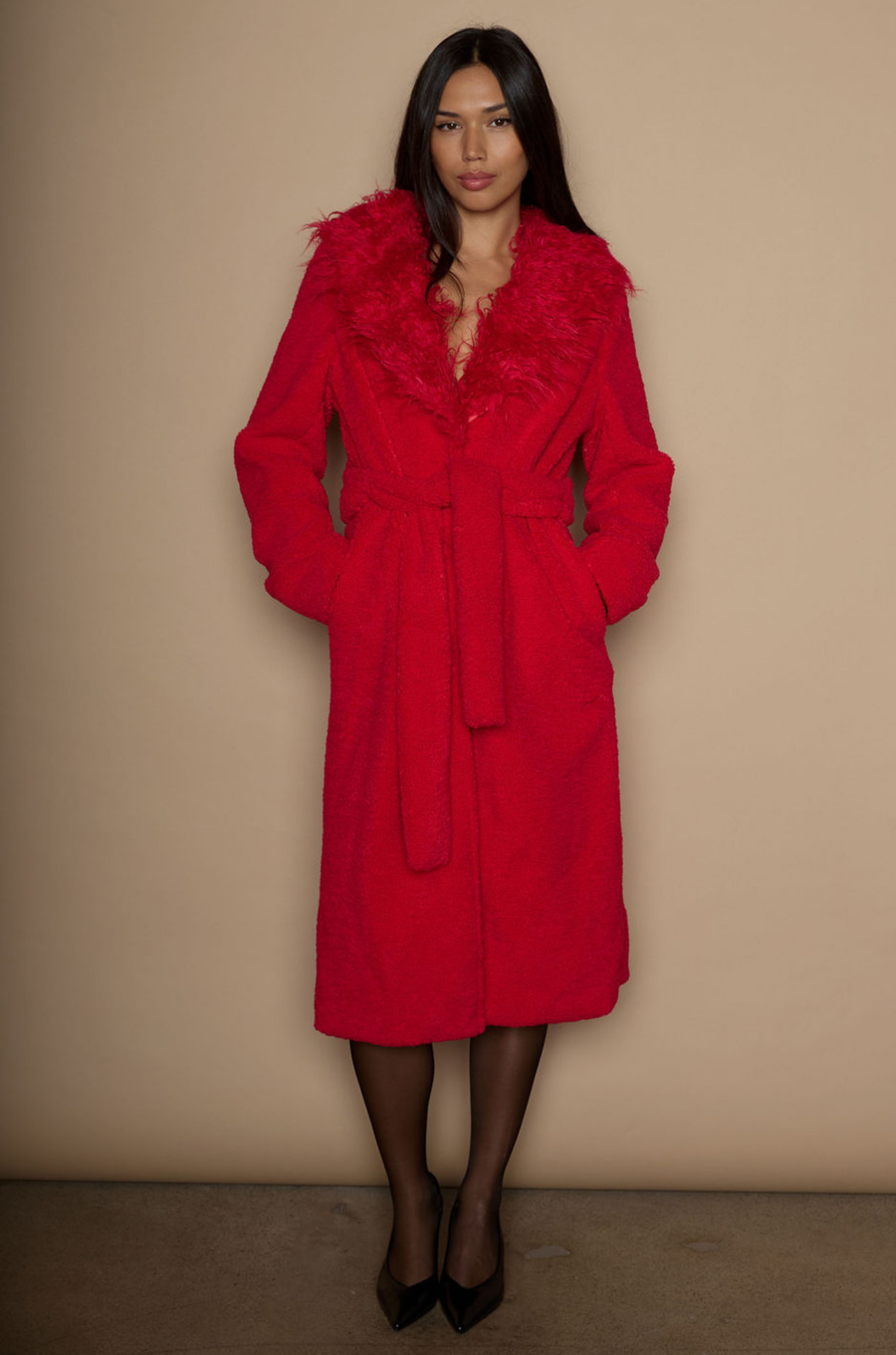 Faux sherpa longline coat. Faux fur collar neckline. Front snap button closure. Tie waist. Side pockets. Back slit. Fully lined. red fur coat. fall outfit. cute winter coat. trendy winter coat.