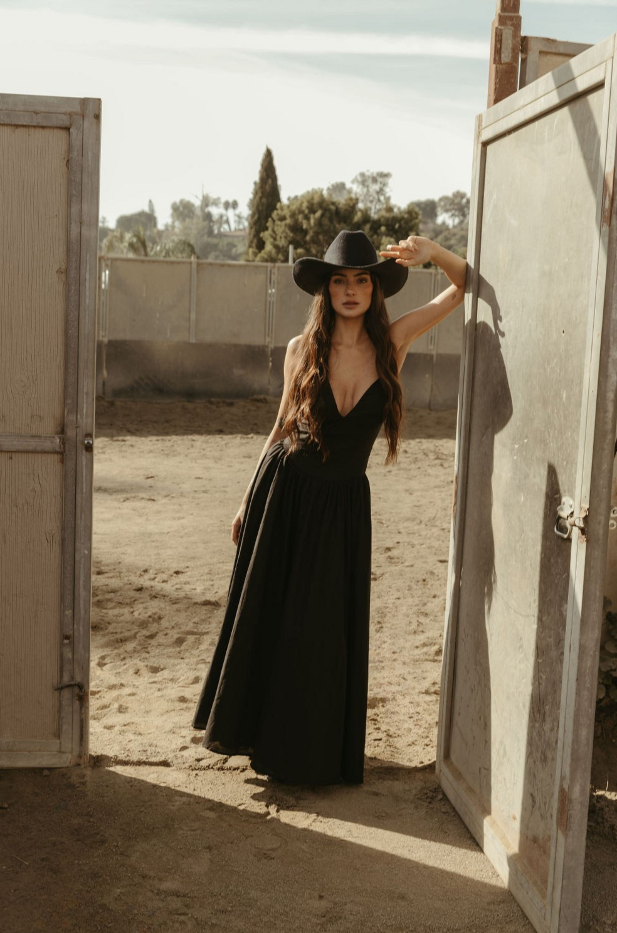 Woven maxi dress. Adjustable crisscross back straps. Back hook and eye and zipper closures. Fully lined. black maxi dress. country outfit. country dress. western outfit. western dress.