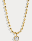 Delicate ball chain necklace anchored with a luminous CZ pendant
14kt gold plated brass&nbsp;or Rhodium plated brass
Stone is a white cz and measures 8.0mmNecklace measures 16" with a 3" extender
Lobster Clasp Closure
Gold chain necklace