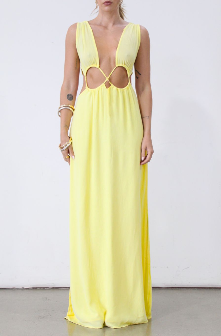 Crinkle woven sleeveless maxi dress. Waist cut outs. Side slits. Back tie closure. Back drawstring waist closure. Partially lined. vacation dress. beach dress. yellow maxi dress. 