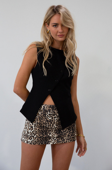 Woven sleeveless top. Asymmetric front button down closures. Back slit. Fully lined. black vest top. going out top. fall outfit. fall top
