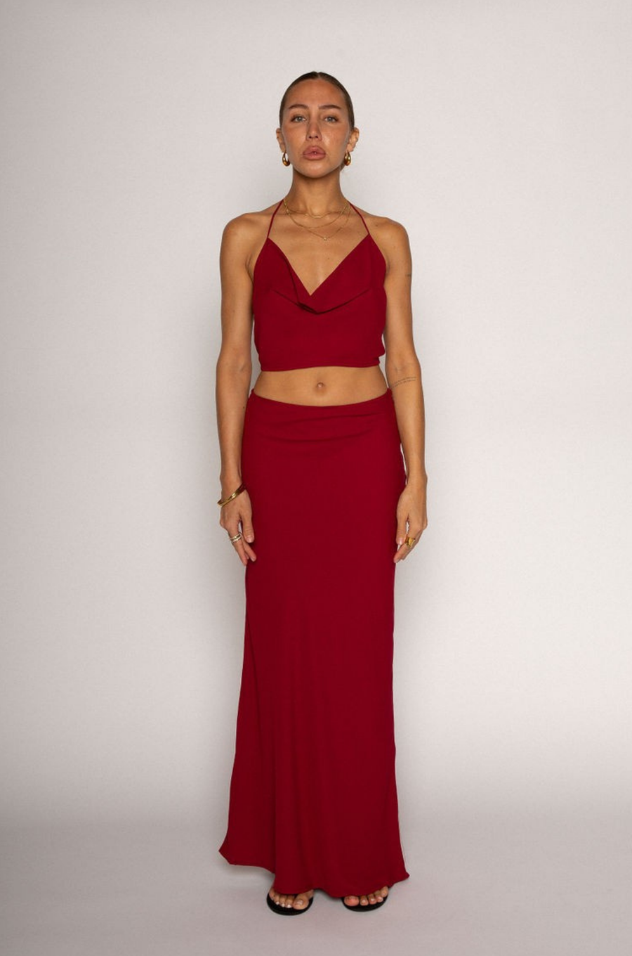 Halter crop top. Adjustable neck and back tie strap. Cowl neck. Partially lined. Maxi skirt. Hidden side zipper. Lined. red skirt set. cherry red skirt set. going out set. nice dinner set. summer outfit. spring outfit.