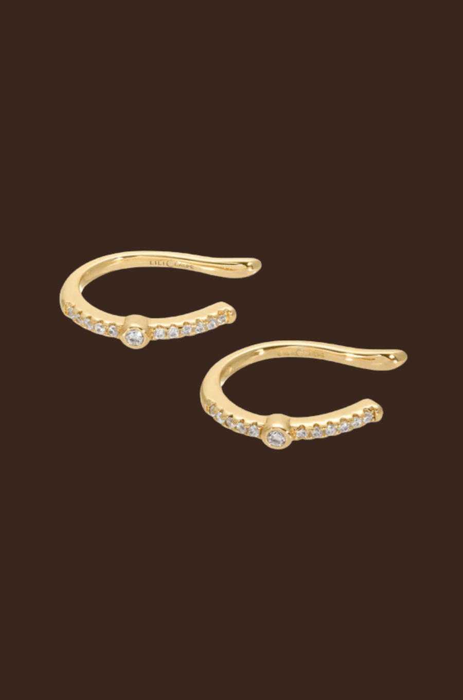 A delicate ear cuff ideal for layering.&nbsp;14kt Gold plated brass.&nbsp;One size.&nbsp;Not adjustable. Sold as a pair.