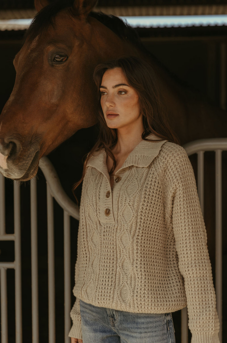 Fuzzy mixed knit crochet sweater. Collar neckline. Front button closures. Long sleeves. Banded hems. Unlined. tan sweater. knit sweater. quarter button up sweater