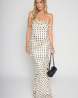 Polka dot printed maxi dress
Tube top
Ruffle on bust trim
Asymmetric ruffle detail on bottom half
Back cut out
Inner rubber grip lining
Side zipper closure
Lined
cream and black polka dot dress
bridal maxi dress