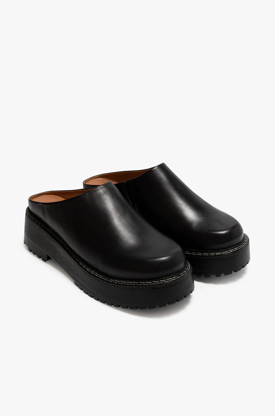 Chunky platform mule slide
Contrast stitching
Leather upper, manmade outsole
Synthetic leather lining
2.5" heel, 1" platform
Imported
black chunky platform slide mule
dr marten dupe
