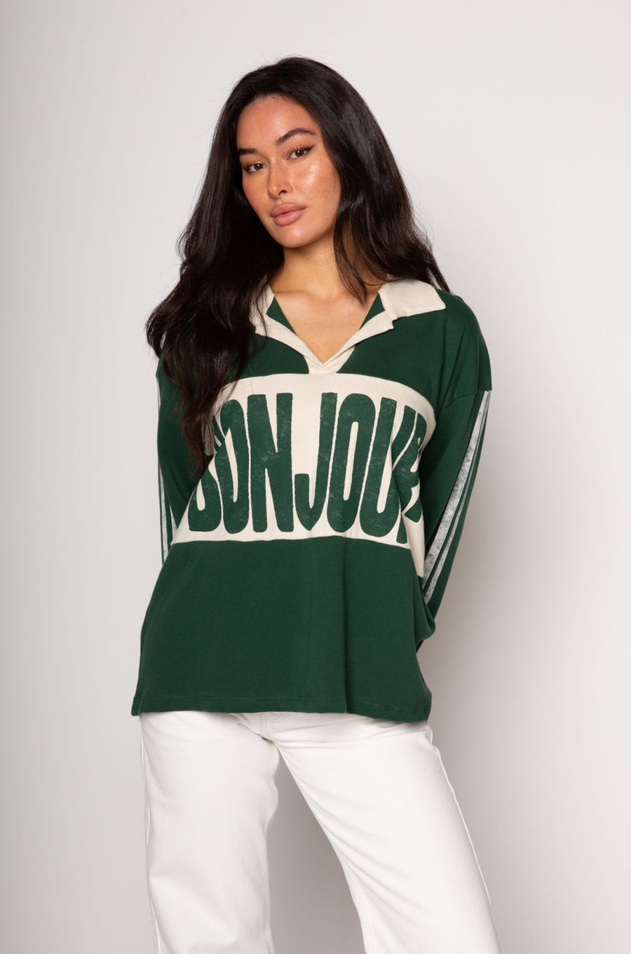 Graphic printed knit top. Collar neckline. Long sleeves. Unlined. green graphic long sleeve tee. bonjour tee