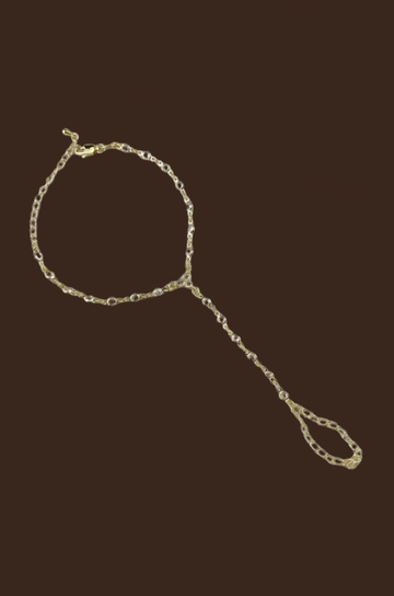 Round bezel hand chain
18K gold filled
Featuring brilliant cubic zirconia stones set in classic round bezel settings
This contemporary hand chain gracefully connects from finger to wrist,
AAAAA CZ Stones
Size: 6 inches + 1.5 extender chain
Hypoallergenic/Water-resistant
gold hand chain