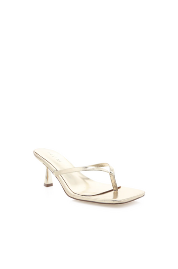 Xami is the perfect casual thong heel that will get you from work to the weekend. This on-trend style will be the perfect addition to your wardrobe.

low kicked-in stiletto heel
open square toe
thin thong toe straps
easy slip on design
open heel counter
synthetic upper, lining and outsole
Heel height: 2.56"
Synthetic
gold kitten heel
gold thong kitten keel