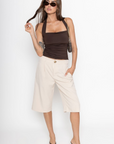 Pleated trouser jorts
Longline shorts
2 side pockets
2 faux back pockets
Button and fly closure
tan jorts
tan trouser jorts
trendy jorts
fall transition outfit