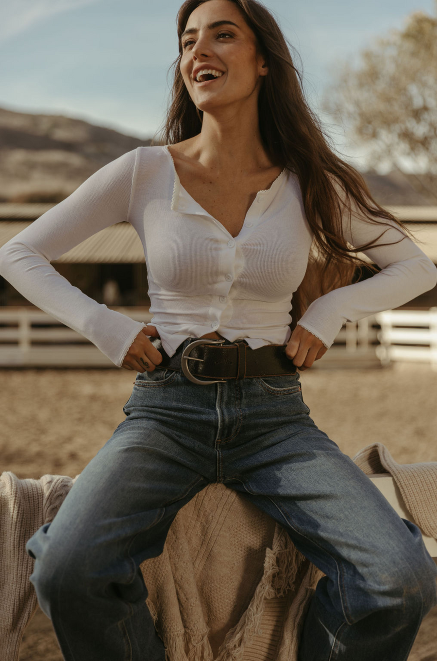 Ribbed knit top. Long sleeves. With elastic sleeve openings. Front button down closures. Unlined. Crochet lace trim. White long sleeve