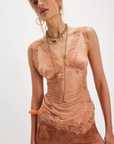 Ruched satin bodice tank top
Smocked backing
Lace trim throughout
V-neckline
Triangle cups
Full length
Asymmetrical hem
peach satin lace tank top