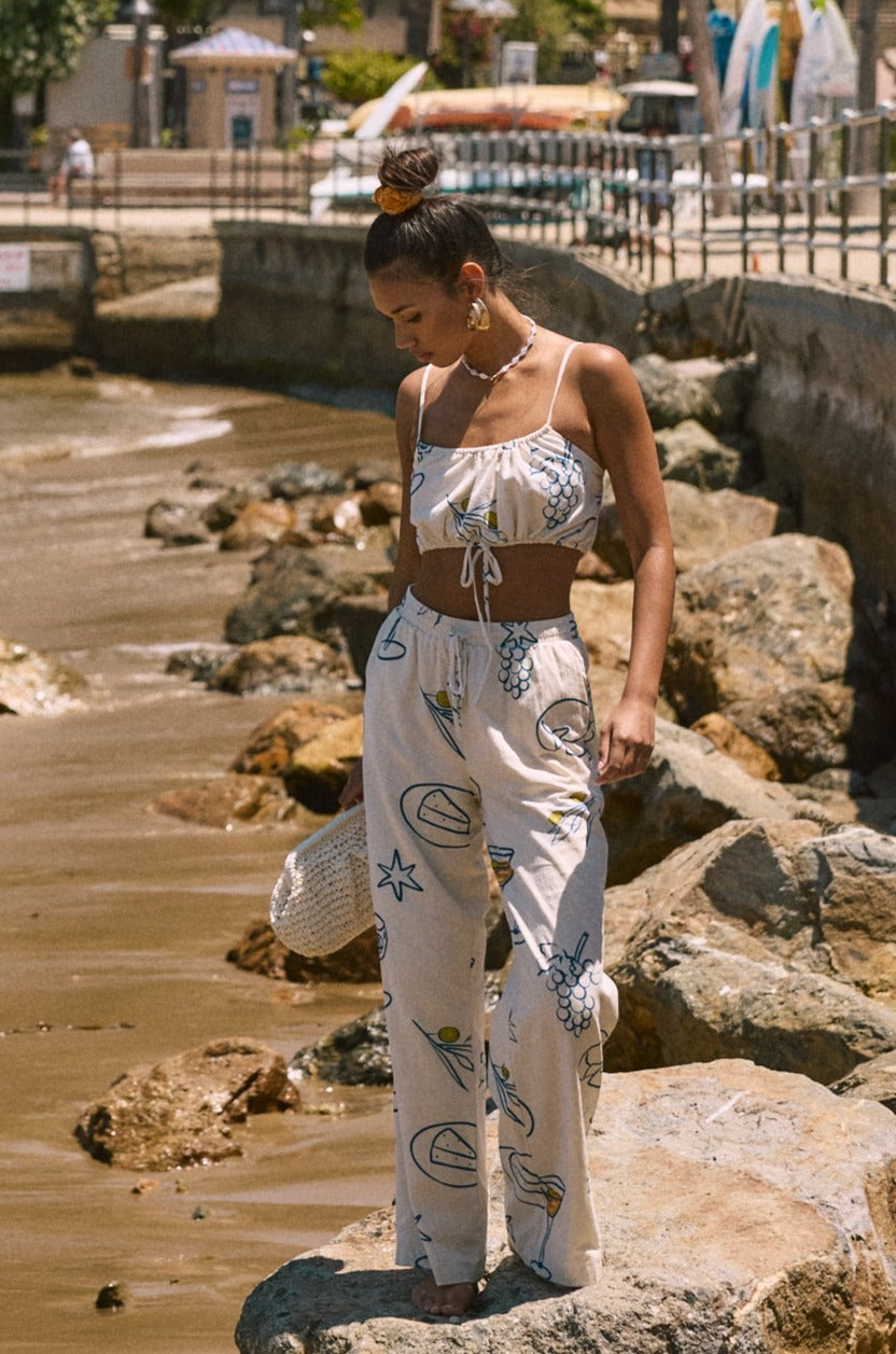 Printed woven wide leg pants. Elastic waistband with drawstring closure. Side pockets. Fully lined. lemon pant. grape and wine pant. summer throw on pant. cute graphic linen pant. european summer pant. summer pant. vacation outfit. cute summer set.