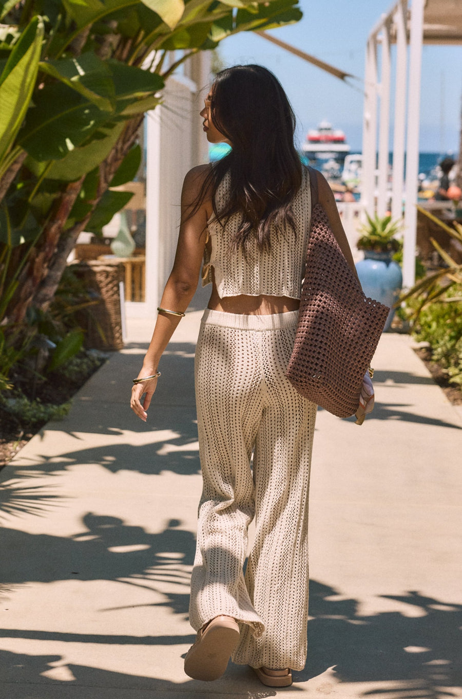 Open knit crop tank. Side cut outs and faux ring details. Unlined/sheer. Open knit crochet pants. Elastic waistband. Unlined/sheer. Beach cover up. beach set. knit crochet set. knit crochet tank. knit crochet pant. tan knit crochet pant set. european summer outfit. european summer set. amalfi coast outfit. 