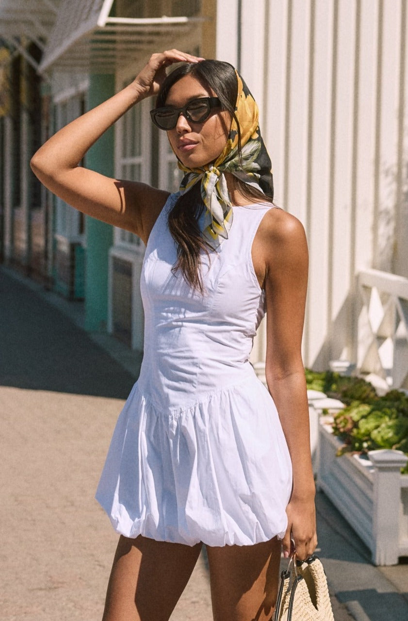 Woven sleeveless dress. Drop waist. Bubble skirt. Side hook and eye and zipper closures. Adjustable lace up back closure. Fully lined. white mini bubble skirt. summer dress. vacation dress. vacation outfit. nice dress. european summer dress. european summer outfit. european summer vacation