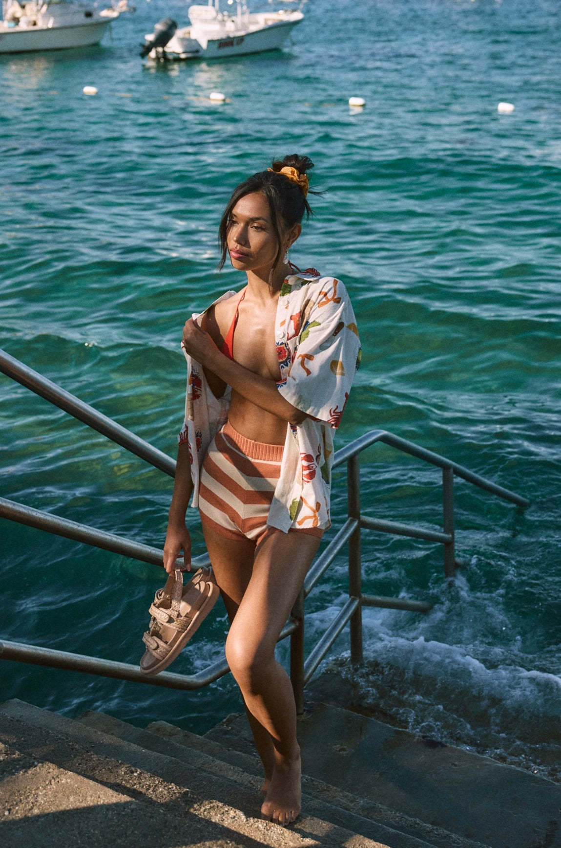 Striped knit shorts. Elastic waistband. Unlined. orange and white stripe shorts. summer shorts. beach cover up. beach short cover up. mexico outfit inspo. beach vacation outfit. european summer shorts. european summer outfit. summer vacation outfit. vacation outfit. shorts to wear on vacation