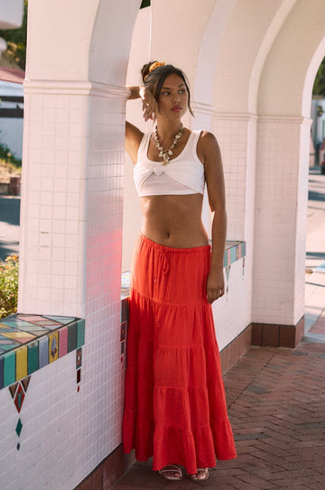 Woven tiered midi skirt. Elastic waist with drawstring closure. Partially lined. red maxi skirt. red midi skirt. red ruffle skirt. red flowy skirt. beach cover up. beach skirt cover up. beach vacation outfit. summer vacation skirt. european summer skirt. european summer outfit. european summer inspo
